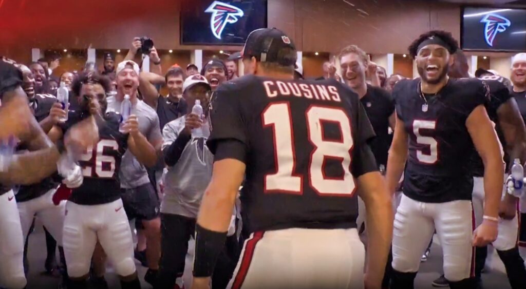 Kirk Cousins in locker room with teammates