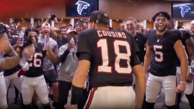 Kirk Cousins in locker room with teammates