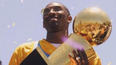 Kobe Bryant with NBA Championship trophy