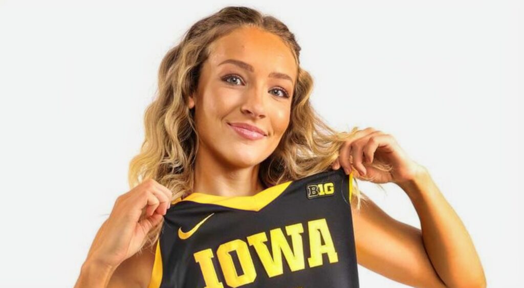 Kylie Feuerbach posing in Iowa jersey