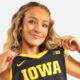 Kylie Feuerbach posing in Iowa jersey