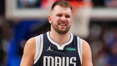 Luka Doncic heading to the locker room, holding his thigh