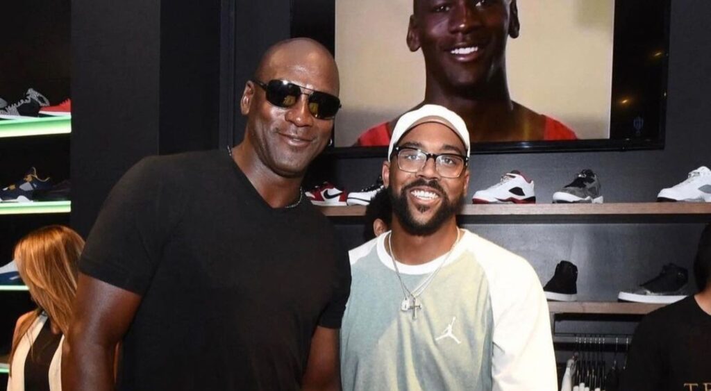 Michael Jordan posing with Marcus Jordan