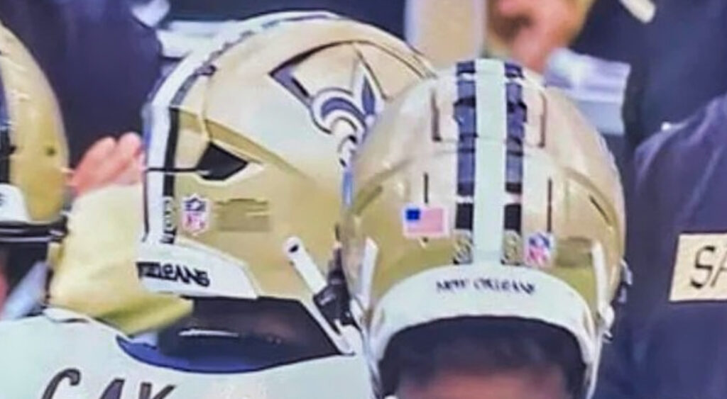 New Orleans Saints players with helmets on