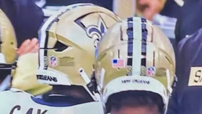 New Orleans Saints players with helmets on