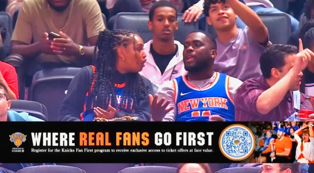 New York Knicks fans arguing in the stands