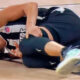 Nika Muhl lying on the court after knee injury