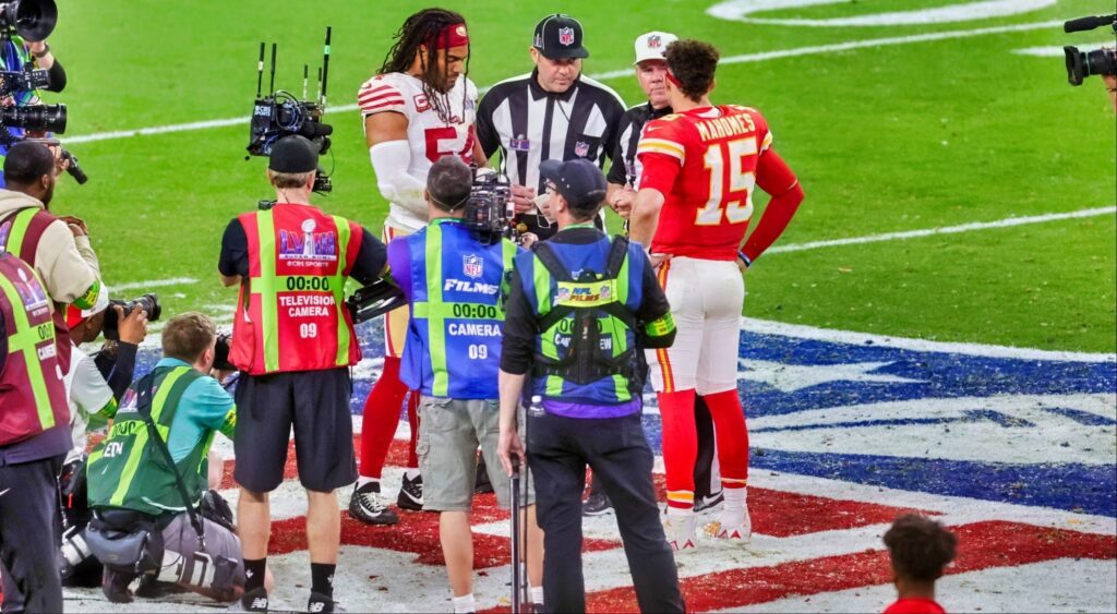 Referee Bill Vinovich talks to linebacker Fred Warner of the San Francisco 49ers and quarterback Patrick Mahomes of the Kansas City Chiefs.