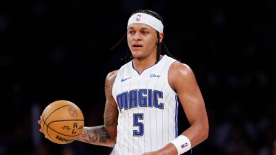 Paolo Banchero of the Orlando Magic dribbles during a NBA Match