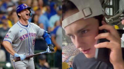 Pete Alonso holding bat and screaming and fan in the stands