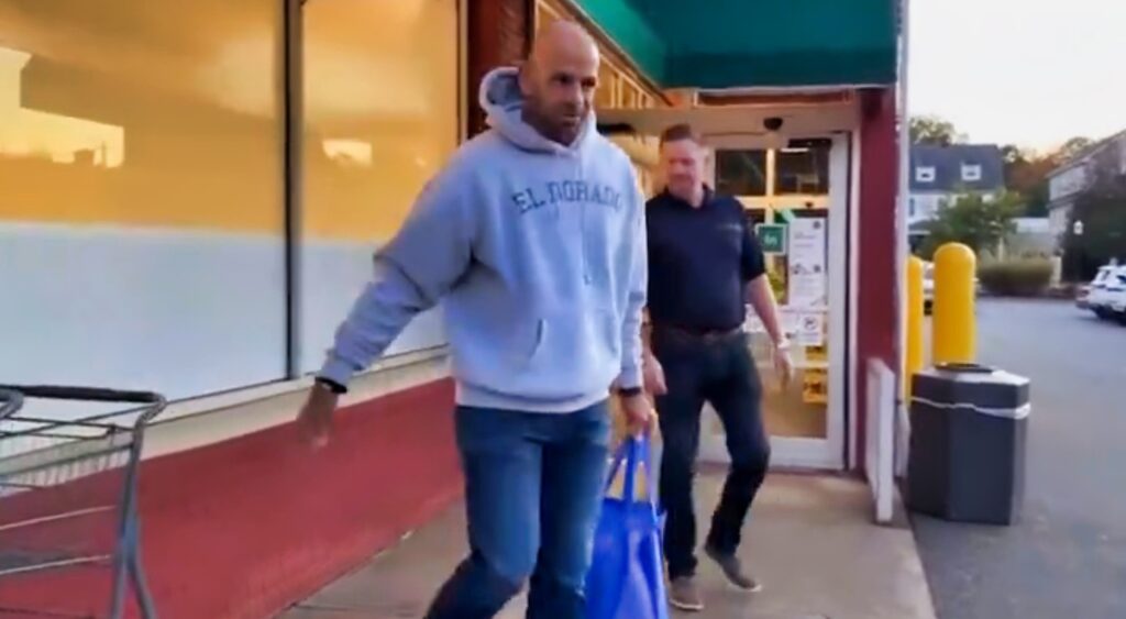 Robert Saleh coming out of a grocery store.