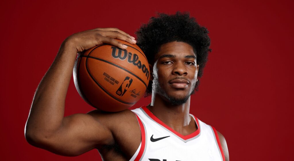 Scoot Henderson poses with basketball for a portrait