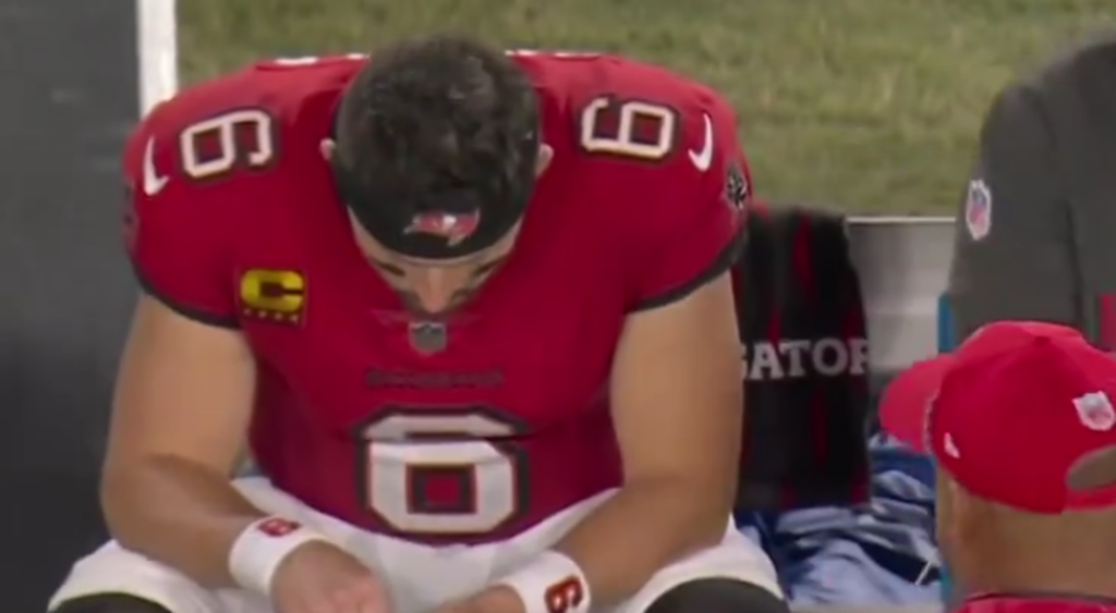 Baker Mayfield popping a Zyn on the sideline