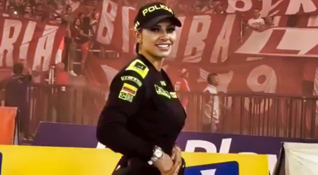 Female police officer at a soccer match.