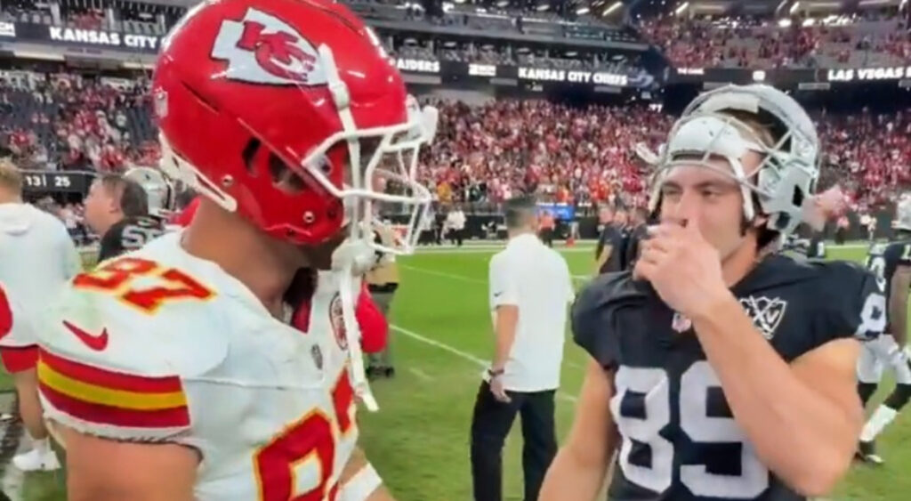 Travis Kelce speaking to Brock Bowers