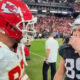 Travis Kelce speaking to Brock Bowers