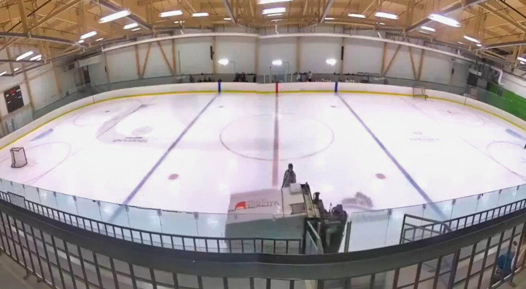 Zamboni being driven on ice