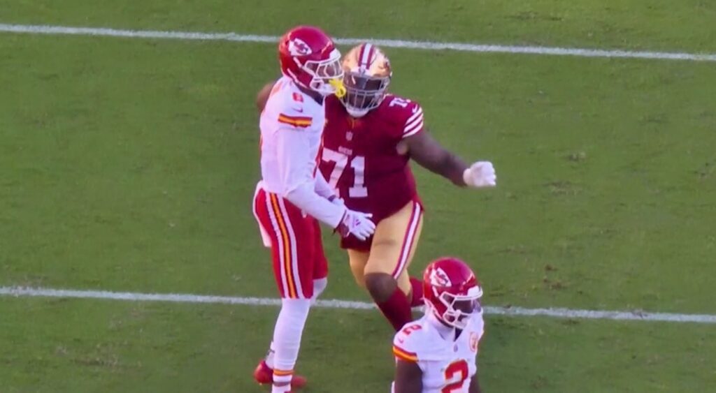 Bryan Cook and Trent Williams exchanging punches in Chiefs-49ers game.