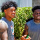 Tua Tagovailoa standing next to Tyreek Hill