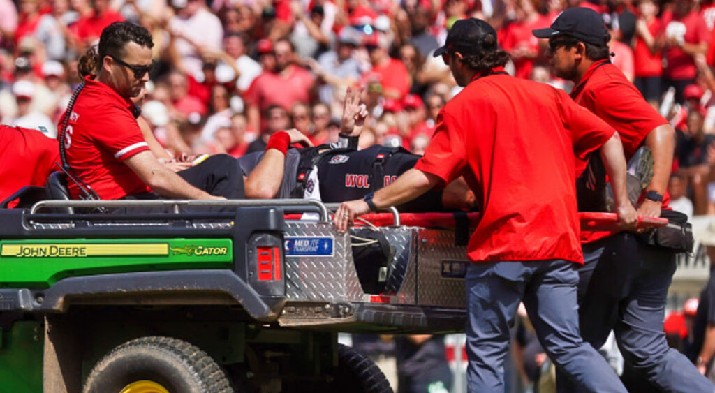 Grayson McCall being carted off