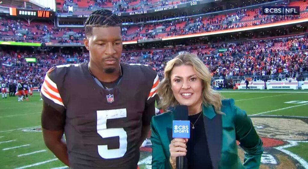 Jameis Winston and Amanda Balionis talking after game.