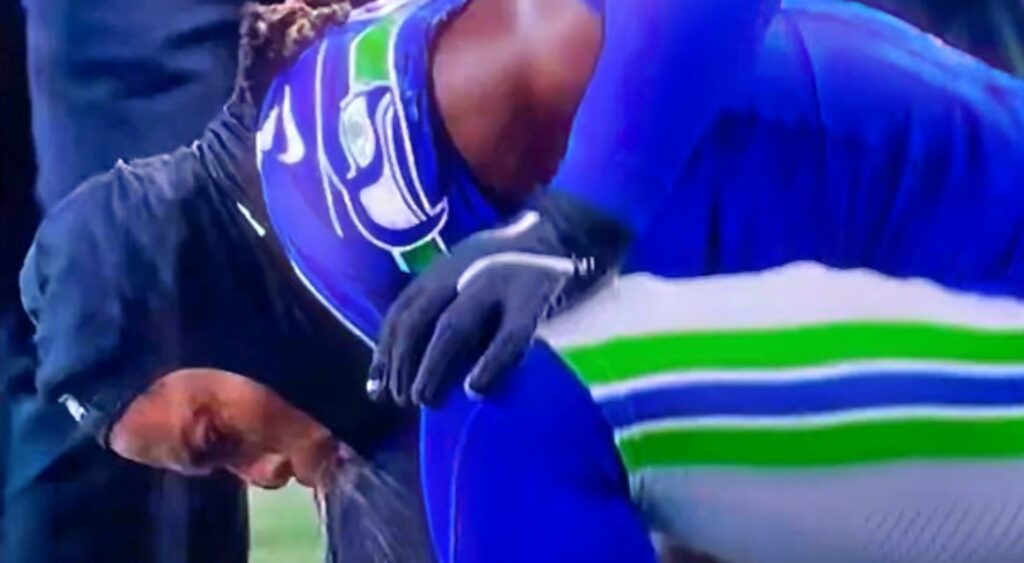 Laviska Shenault of Seattle Seahawks puking on sidelines.