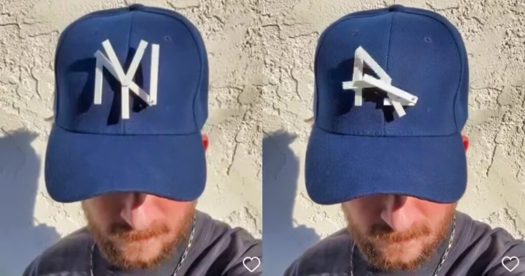 New York Yankees fan showing new hat.