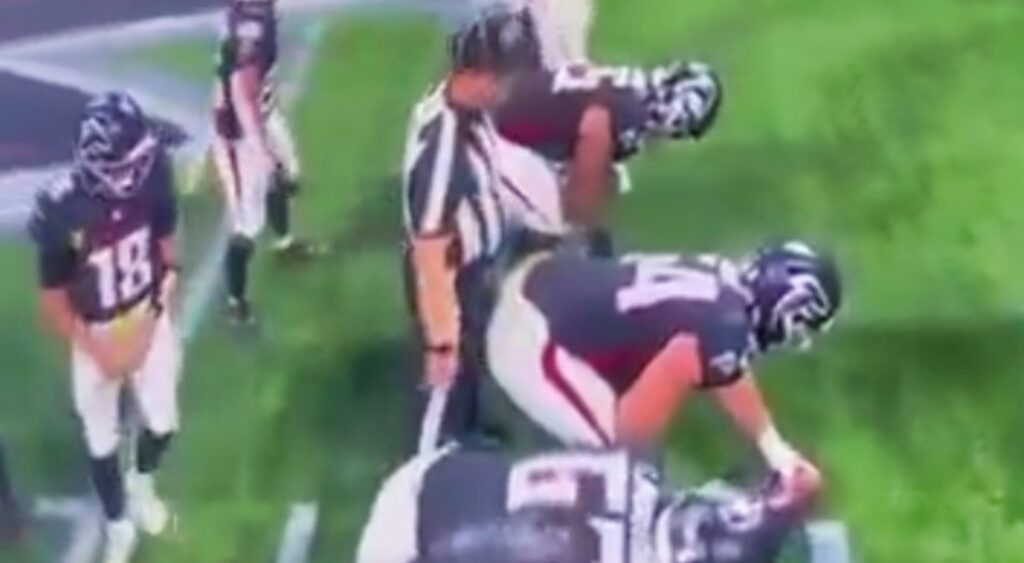 Atlanta Falcons Player and ref on field