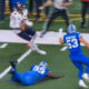 Caleb Williams running with football during Bears-Lions game