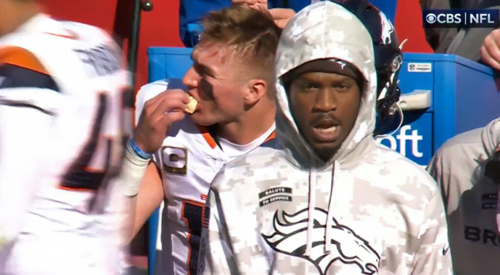 Bo Nix eating on sideline