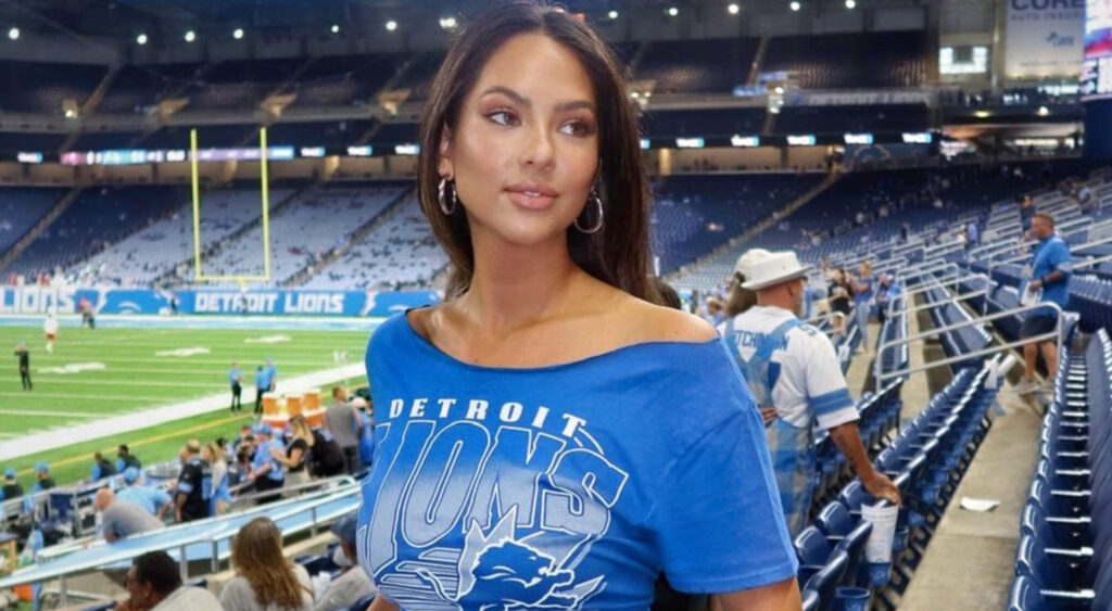 Christen Harper in blue Lions top