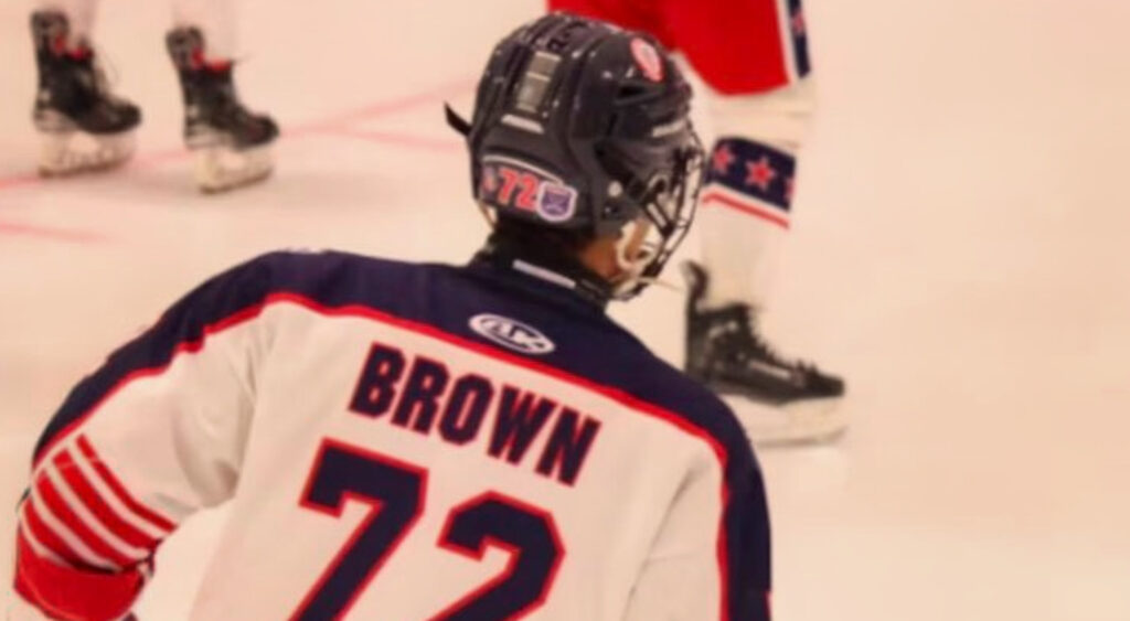 Photo of Colin Brown at hockey game