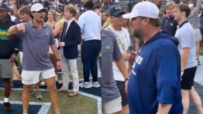 Georgia Tech staffer and fan on field