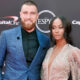 Travis Kelce posing with Kayla Nicole