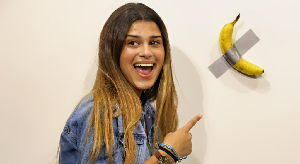 Woman pointing to duct-taped banana