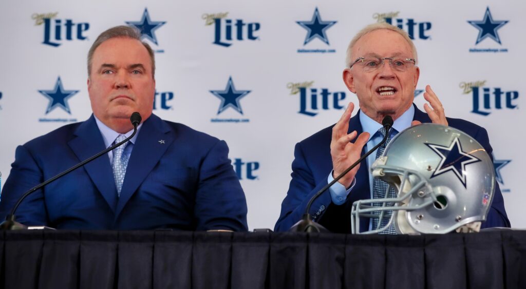 Mike McCarthy and Jerry Jones at a press conference.