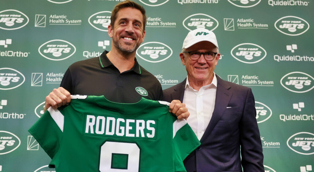 Aaron Rodgers posing for photo with Woody Johnson