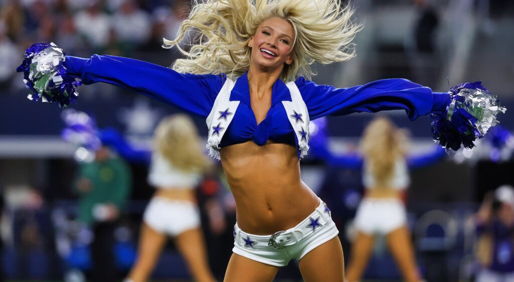 Dallas Cowboys cheerleader performing on field