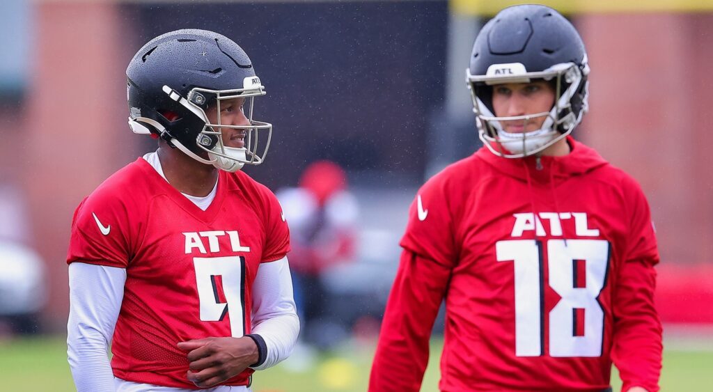 Michael Penix Jr. and Kirk Cousins speaking at practice.