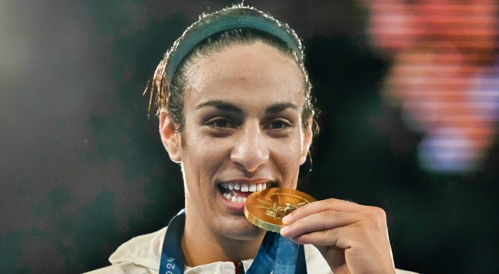 Imane Khelif with gold medal in her mouth