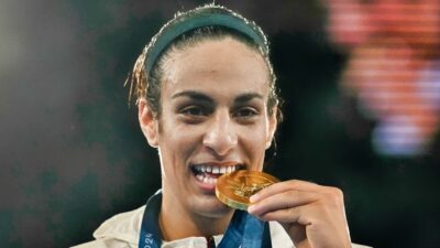 Imane Khelif with gold medal in her mouth