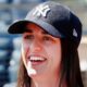 Caitlin Clark smiling in Yankees cap