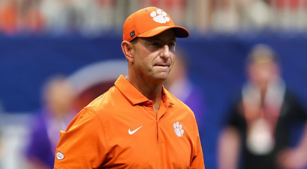 Clemson Tigers football coach Dabo Swinney looking on.