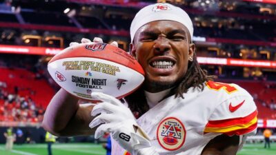 Rashee Rice holding a football