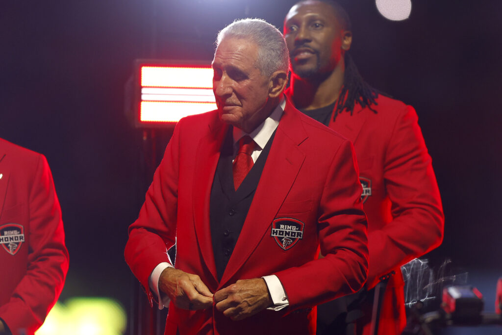 Arthur Blank in red suit