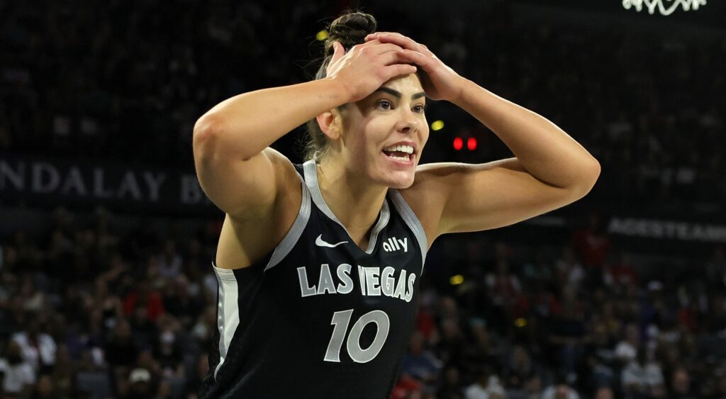 Kelsey Plum with her hands on her head