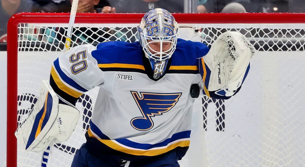 Jordan Binnington making a save during game.