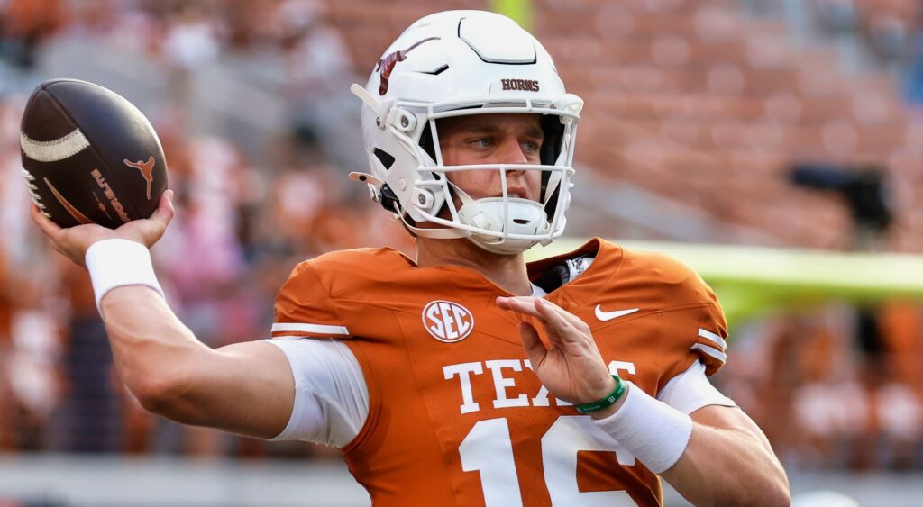 Arch Manning throwing a football