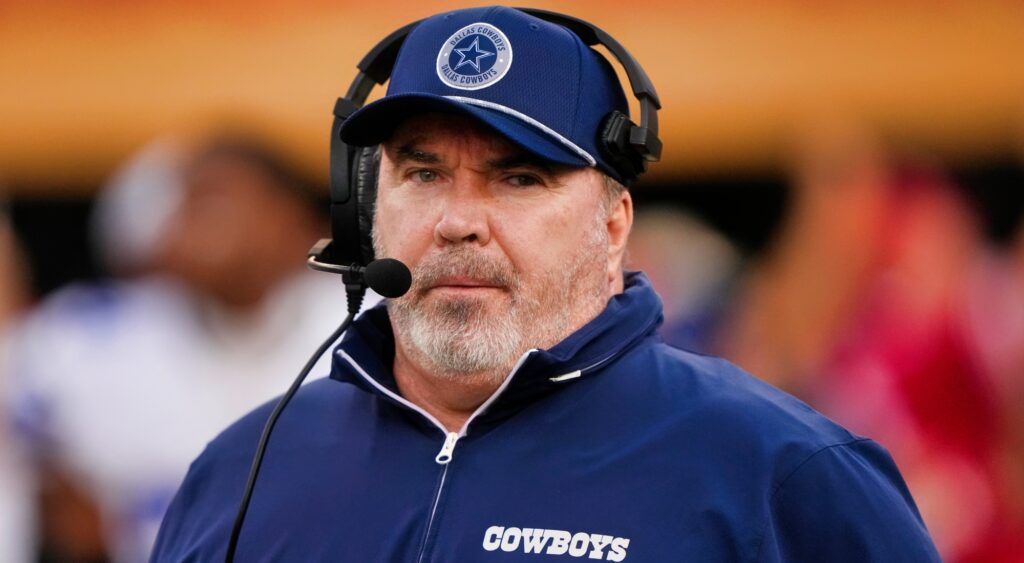 Mike McCarthy of Dallas Cowboys looking on.