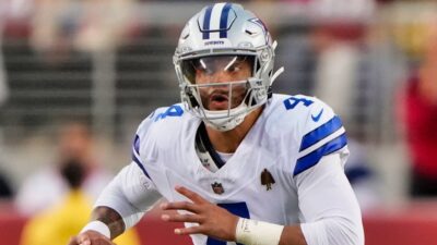 Dak Prescott running with football